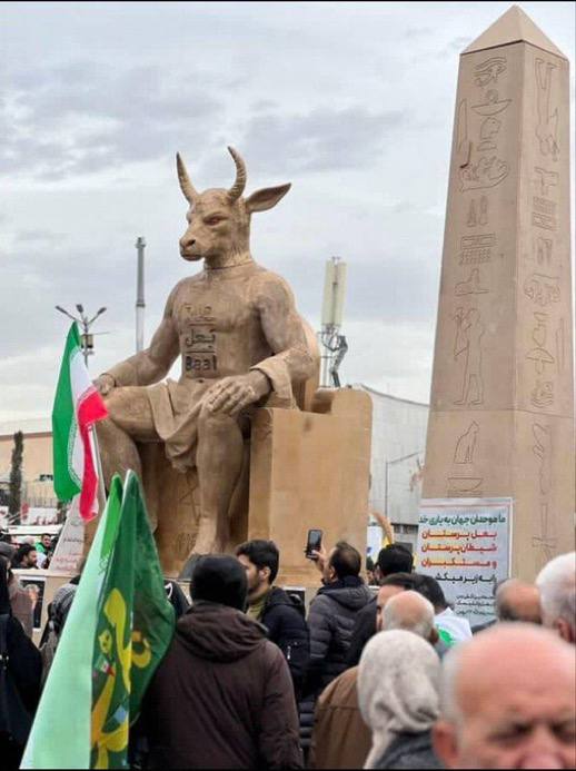 Iranian regime supporters burn a mock-up depicting a Star of David inscribed with Baal