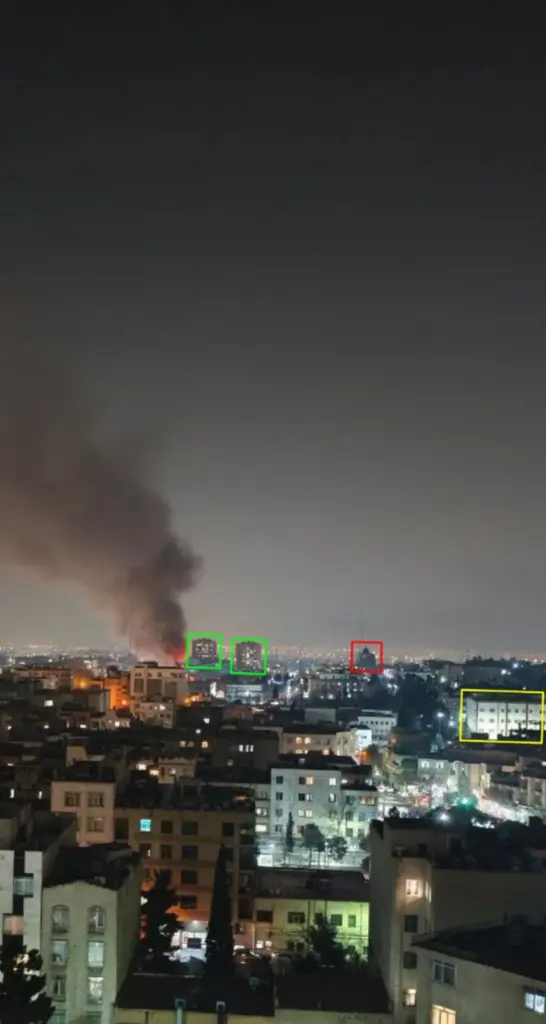 Fire and smoke rise over Tehran skyline at night during Iran protests, February 2026
